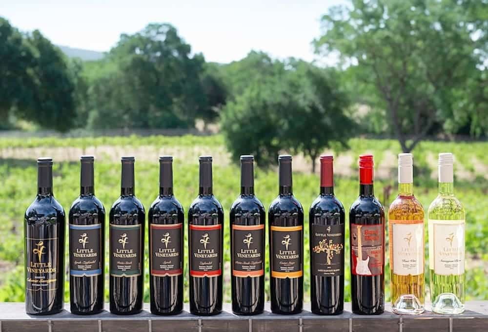 little vineyard bottle line up outside in spring