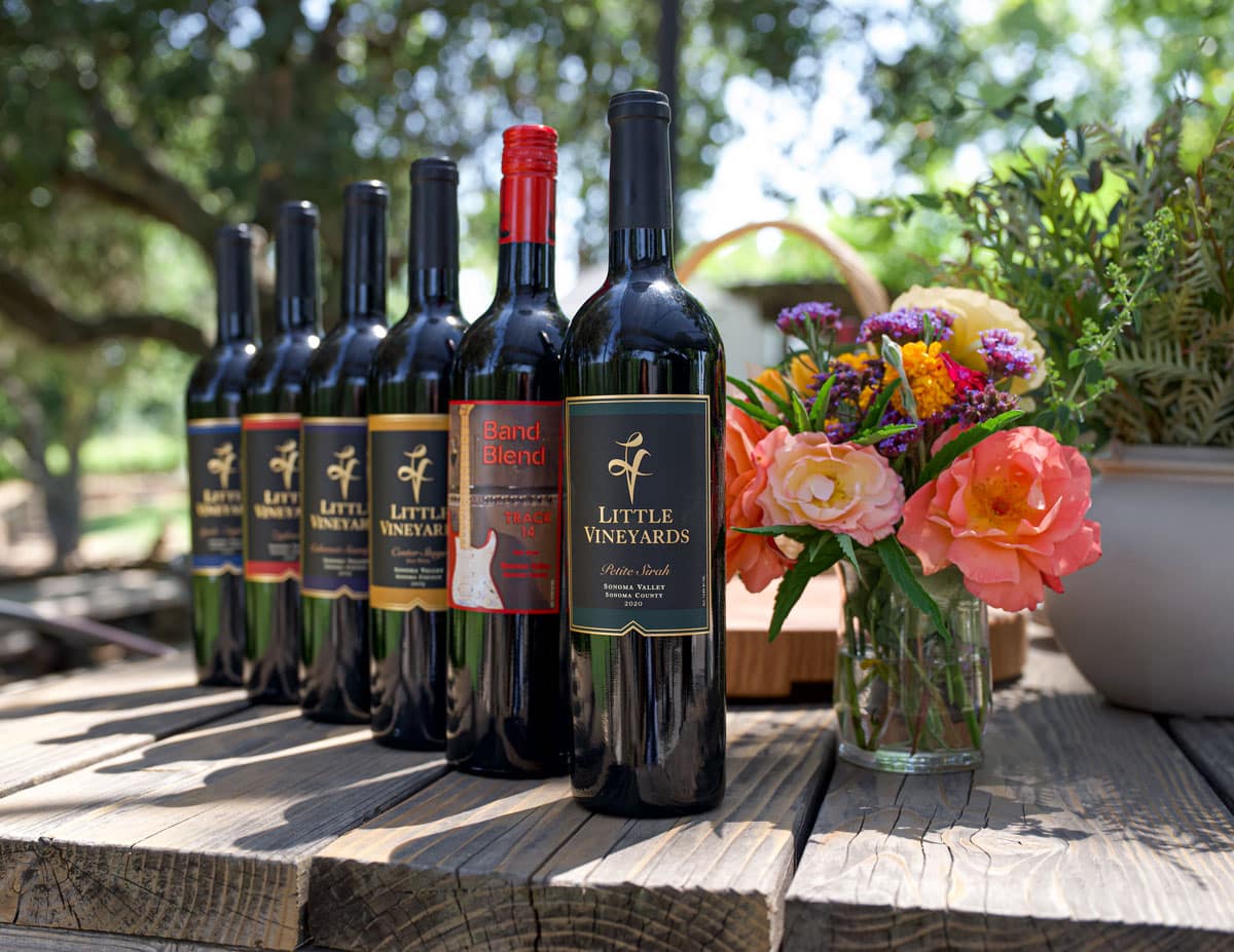 Little Vineyards Wine displayed on a table outside